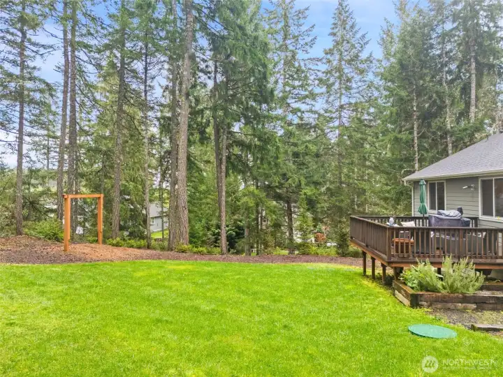 The wooden arch is made for a swing/s.