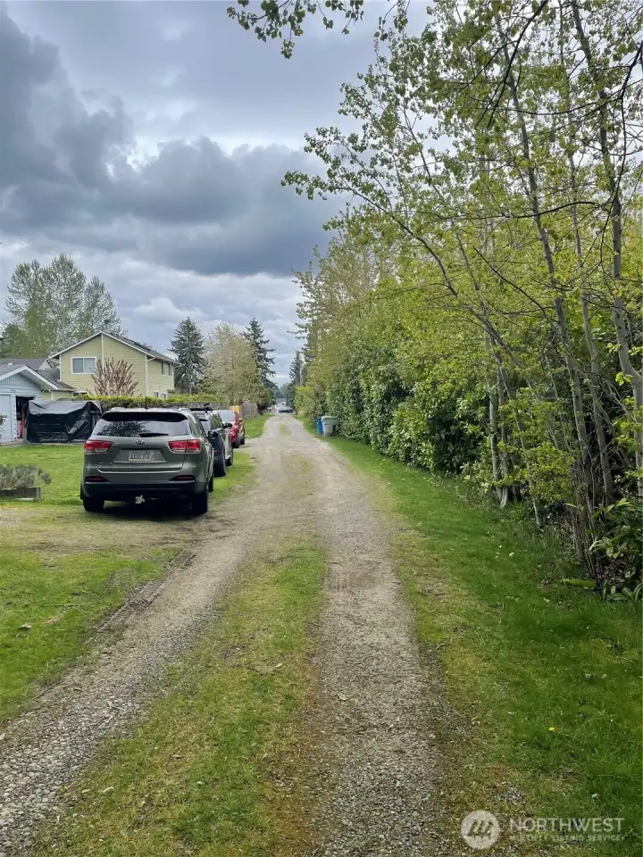 View from back of property at end of flag. Looking toward 192nd. Entire road conveys with the property making it ideal for development.