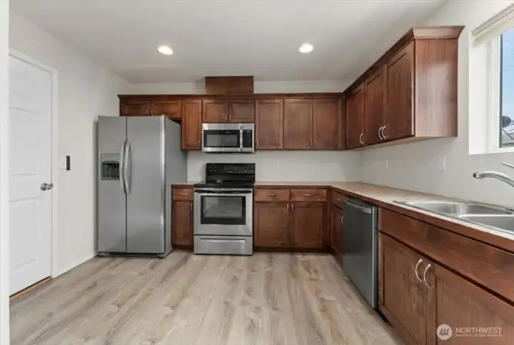 Refrigerator, oven, microwave, and dishwasher in both units are included in the sale.