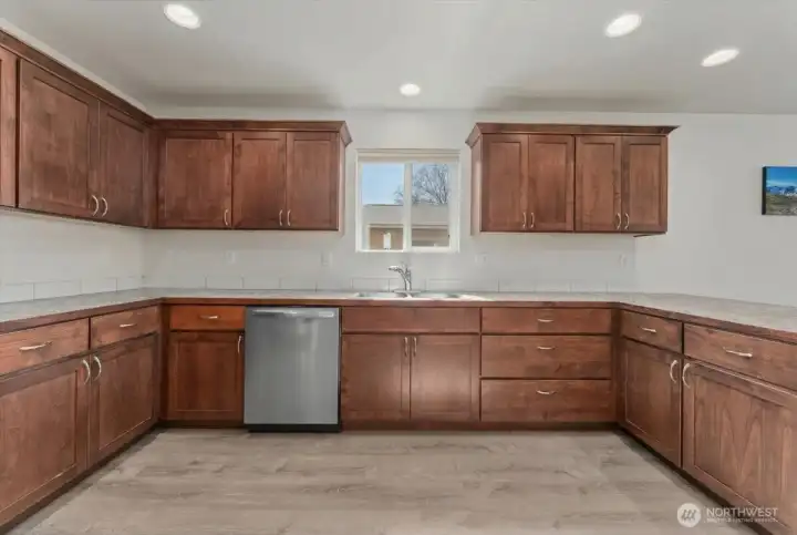 Lots of cabinets and space in the well designed kitchens.