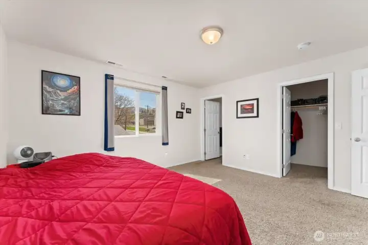 Primary bedroom looking towards the primary bathroom and closet.