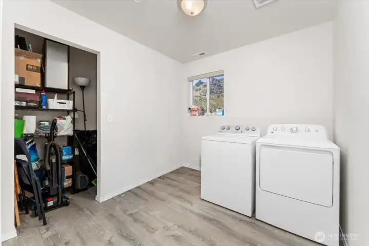 Laundry room upstairs. Washer & dryer in both units are included in sale. Large storage closet too.