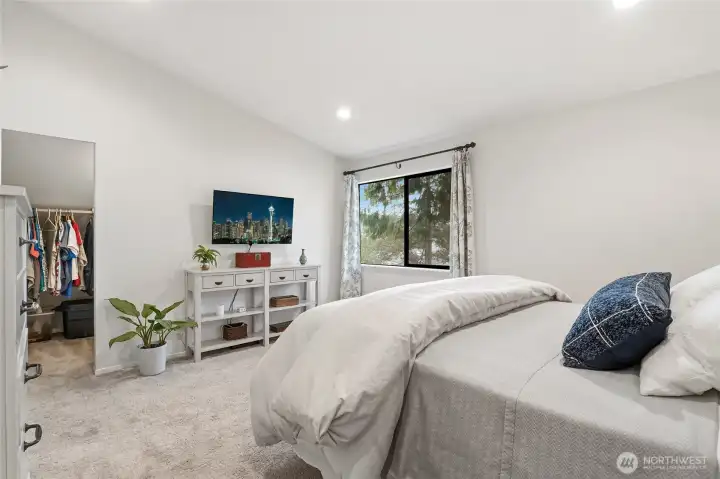 Primary features vaulted ceilings, and two walk in closets