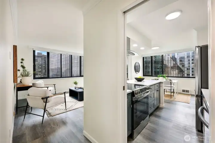 Just imagine walking in your front door each day to be greeted by these views, all the reflected light off of neighboring buildings, and this chic interior.