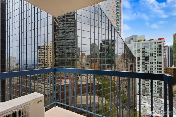 Sip morning coffee or relax with a good book out on your private balcony - 18 floors up and many sounds of the city are dulled to just background noise.