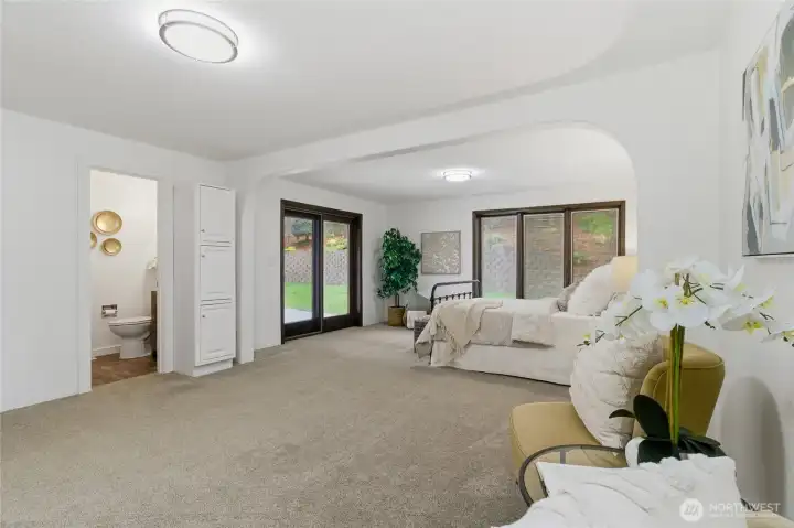 Primary bedroom with slider out to back patio