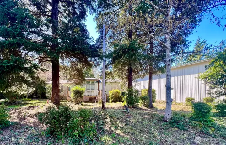Double wide with huge 2400 sq' shop on beautifully landscaped double lot.