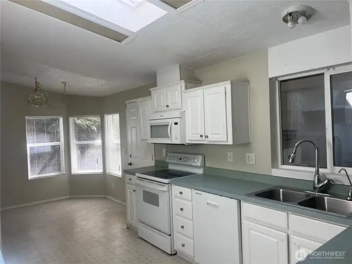Looking into kitchen and breakfast nook