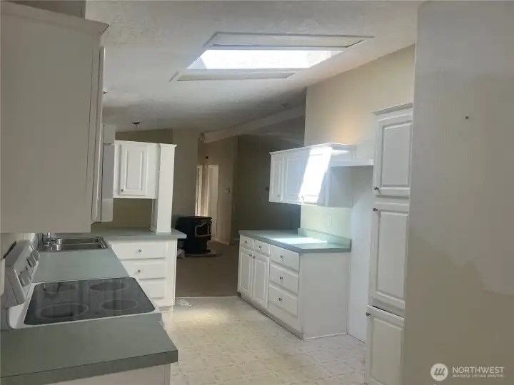 Looking from kitchen to dining and living area