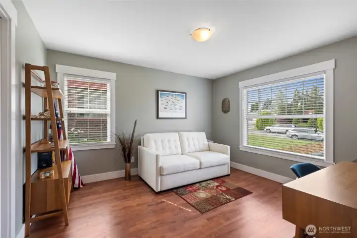 2nd bedroom on the main floor looks to the front of the home with large picture window is and is currently utilized as an office. Rooms are a substantial size.
