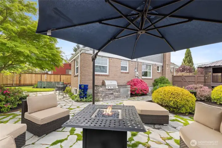 Exceptional outdoor living with cozy space, expansive entertaining patio, and lush professionally maintained grounds.