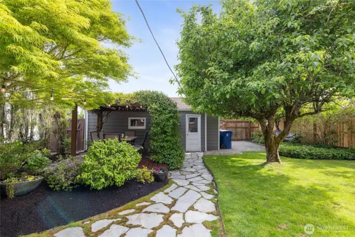 Detached garage/shop is conveniently located from the backyard space. Fully fenced enclosure for 28' RV/Boat.