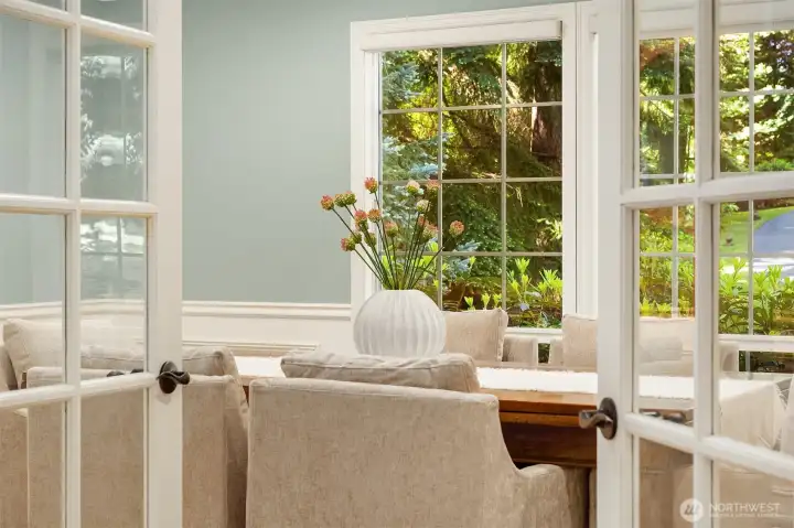 French doors welcome you into the main-level dining room, creating an elegant space for gatherings and entertaining.
