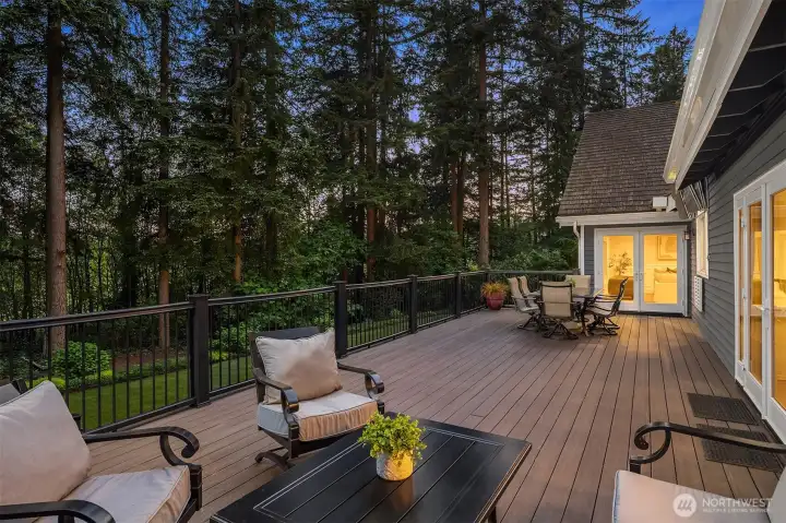 Unbeatable indoor/outdoor living with this Azek deck featuring stairs that lead directly to the backyard.