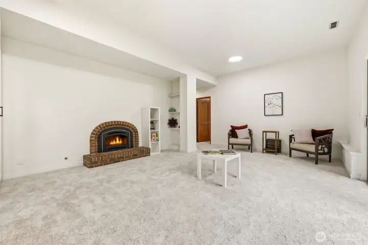 Expansive Lower-Level Family Room with Fireplace Expansive Lower-Level Family Room with Fireplace
