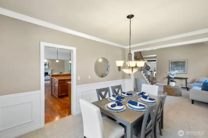 Dining room off kitchen with wainscoting and beautiful cove moulding! Dining room off kitchen with wainscoting and beautiful cove moulding!