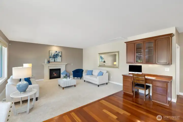 Family room with elegant stone fireplace surround. Family room with elegant stone fireplace surround.