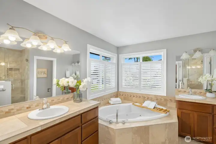 Spacious primary bathroom with his & hers vanities. Spacious primary bathroom with his & hers vanities.