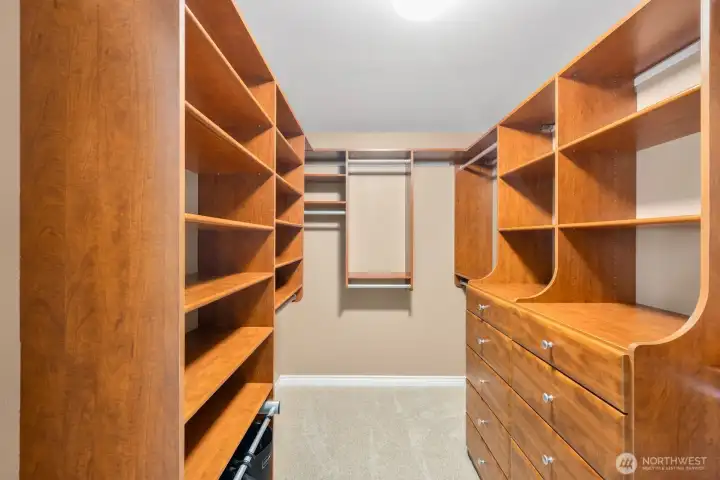 Custom primary closet. Custom primary closet.