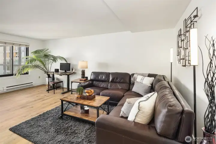Generous living room with laminate hardwoods throughout. Generous living room with laminate hardwoods throughout.