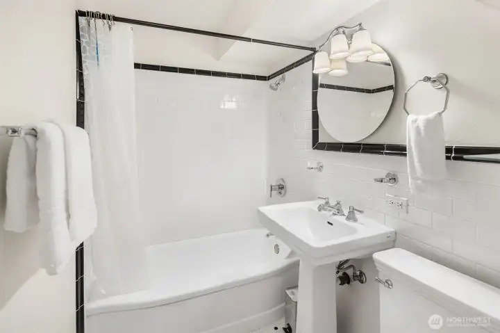 Full bath with vintage style ceramic title floors. Full bath with vintage style ceramic title floors.