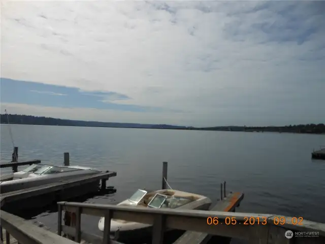 Dock view looking southeast toward Mt. Rainier and Mercer Island.  Slips are owned by residents in the building and there is potential to rent from someone not using theirs.