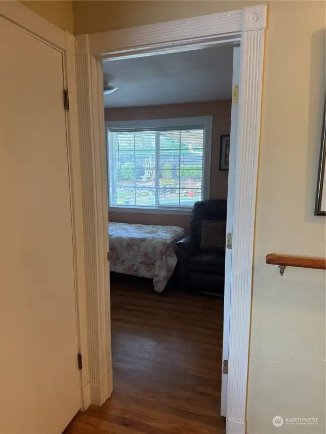 First bedroom with door open and closet to the left