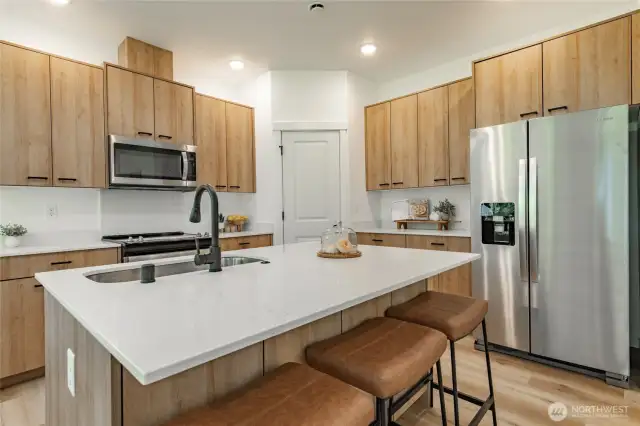 Photos shown are of a similar floor plan previously built in a different neighborhood (The Ridge in Blaine). Finishes and features may vary. Some items pictured reflect buyer-selected upgrades which are not included in the base price and may be added at an additional cost.