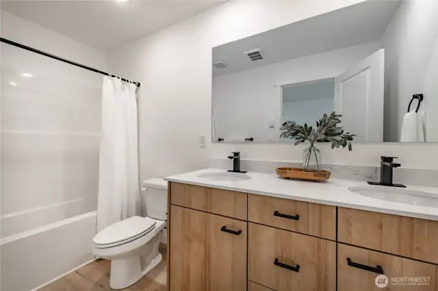 Photos shown are of a similar floor plan previously built in a different neighborhood (The Ridge in Blaine). Finishes and features may vary. Some items pictured reflect buyer-selected upgrades which are not included in the base price and may be added at an additional cost.