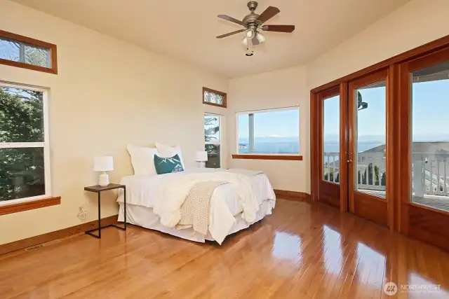 Large primary bedroom with views of Hat Island and Mt Baker
