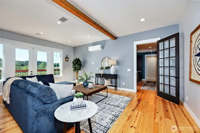 The breezeway to the garage and stairs to the suite above also serves as the utility room with room for a washer/dryer as well as extra storage.