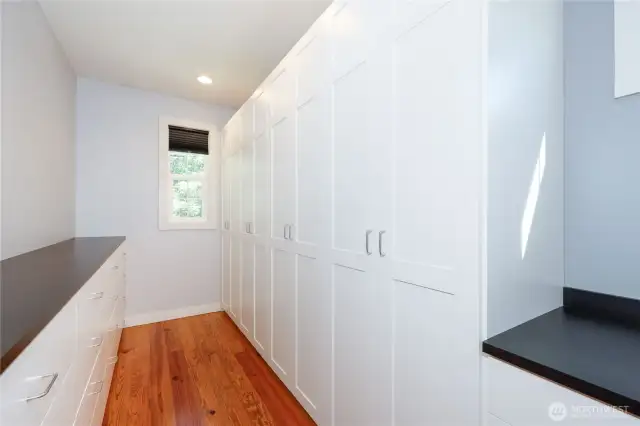 The primary suite features a large walk-in closet with a custom storage system that will make life easy! Note the coffee bar space where you can brew that morning cup before you step into whatever comes next in your day.