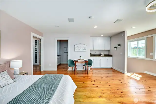 This above-garage suite has a small kitchenette, a private 3/4 bath, and a huge closet system with room for a desk if desired.
