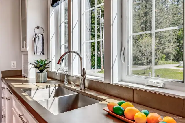 The tall windows welcome the outdoor views year round.