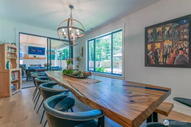 Plenty of guests have a seat at the table in this large dining room.