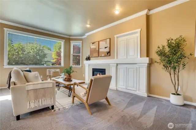 2nd living room on the main floor overlooks the fully fenced, private backyard
