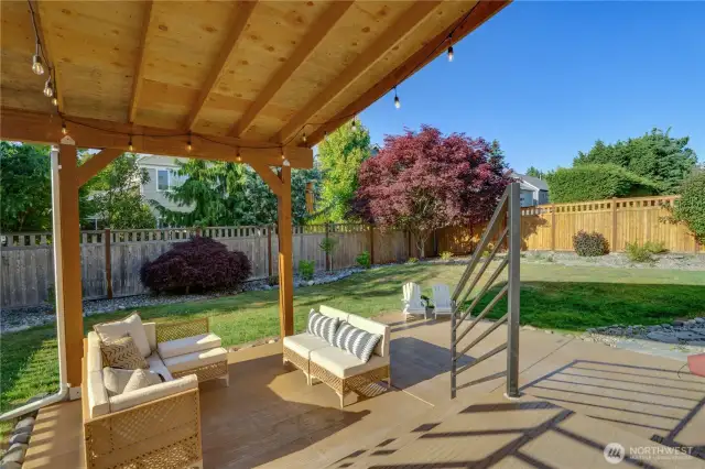 Stamped concrete back patio with cover. Enjoy your backyard throughout the year. Stamped concrete is aesthetically pleasing, easy to clean and maintain.