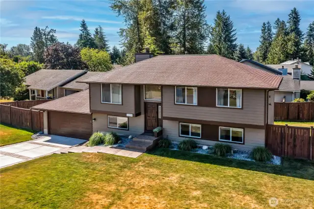 Split level home with Stamped concrete driveway and walkway