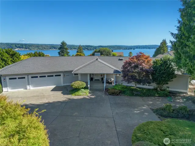 This meticulously custom-built one story home is designed to showcase sweeping territorial, majestic Mt. Rainier, and Puget Sound views.