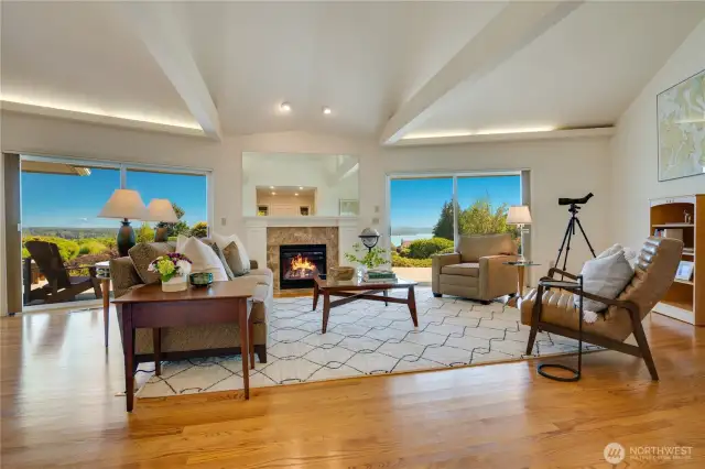 Upon crossing the threshold, you’re instantly captivated by the expansive, awe-inspiring views of Mt. Rainier, Puget Sound, and lush territorial landscapes, framed perfectly through three grand sliding glass doors.
