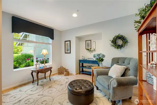 Upon entering, you’re greeted by a welcoming formal living room—an elegant space with large windows that fill the room with natural light.