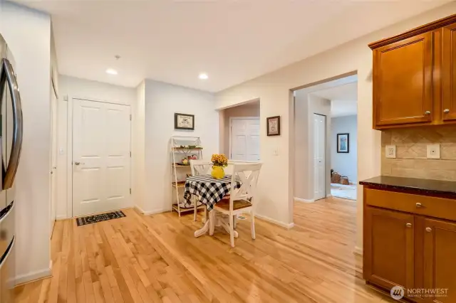 Eat-in kitchen with stunning hardwood flooring.