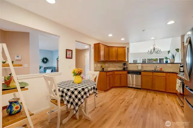 Modern finishes and a practical layout make cooking a joy, while the adjoining dining area easily accommodates both everyday meals and special gatherings.
