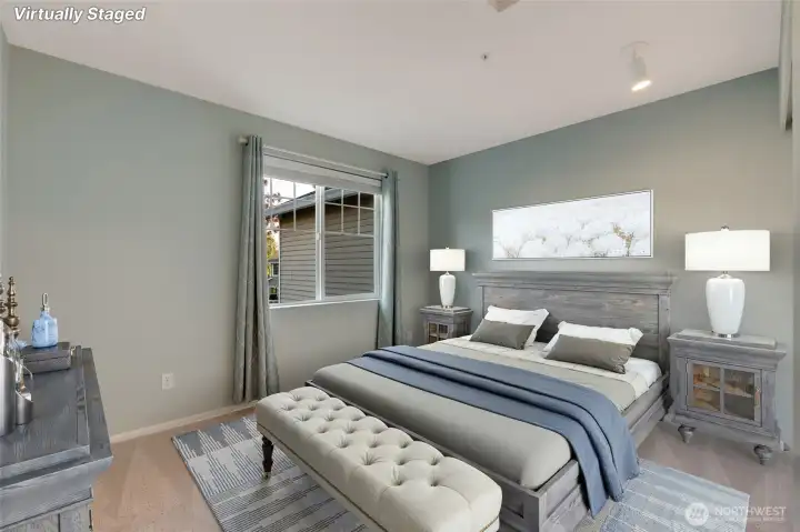 A second bedroom and full bath provide an ideal setup for guests or family, offering comfort and privacy away from the main-level suite. [Photo is virtually staged.]