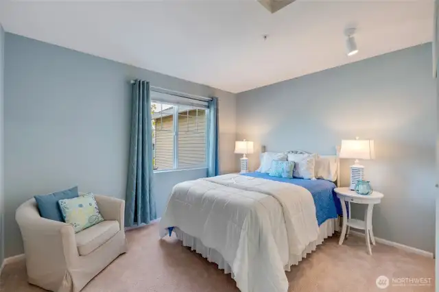 A second bedroom and full bath provide an ideal setup for guests or family, offering comfort and privacy away from the main-level suite.