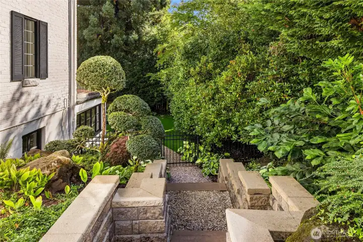 There is a neat gravel pathway around the side of the home leading to the lower level.