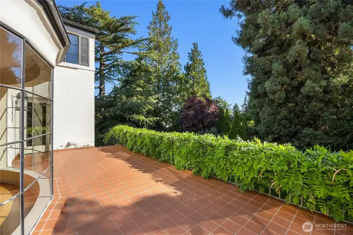 You can enter this fabulous terrace right off of the dining room.  Plus, there are stairs leading down to the backyard.