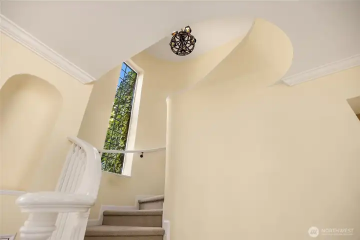 Front hall stairs leading to the second floor.