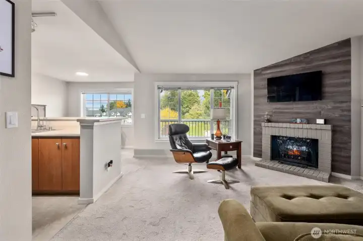 Light and bright, vaulted ceilings, wood burning fireplace currently has an electric insert that can be removed or stay.