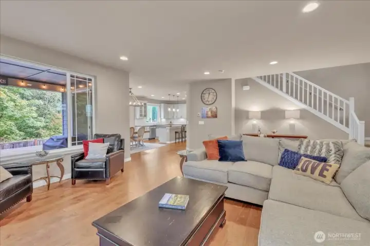 Third view of living room looking into the dining room and kitchen.  A true open concept floor plan!